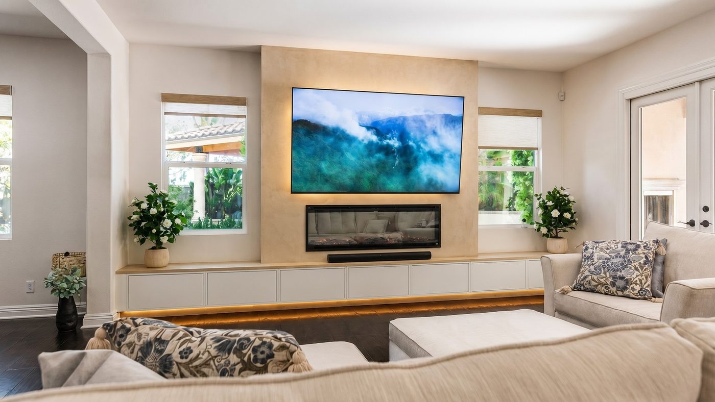 Floating cabinet media wall with warm under-glow lighting