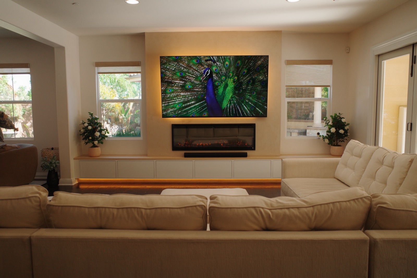 Custom media wall with a floating credenza, daylight